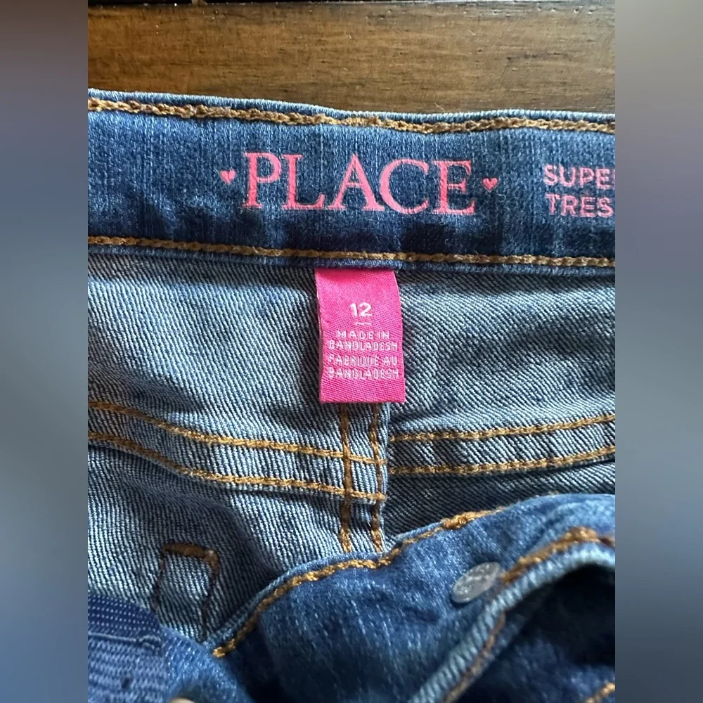 The Children’s Place girls jeans size 12. medium wash and dark wash 2 pairs!